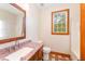 Bathroom with granite countertops, custom vanity, and natural light from the window at 317 William Dr, Benson, NC 27504