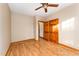 Bedroom featuring hardwood floors and a closet with wooden doors at 317 William Dr, Benson, NC 27504