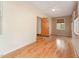 Sunlit bedroom with hardwood floors, neutral walls, and a walk-in closet, offering a comfortable and inviting space at 317 William Dr, Benson, NC 27504