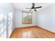 Bedroom featuring hardwood floors, ceiling fan, and a large window at 317 William Dr, Benson, NC 27504