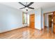 Bedroom with hardwood floors and natural light streaming through a large window at 317 William Dr, Benson, NC 27504