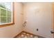Room with bare walls and flooring, and a window letting in natural light at 317 William Dr, Benson, NC 27504