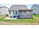 Backyard view featuring a screened porch and patio area with seating at 3338 Prospect Parkway Pkwy, Durham, NC 27703