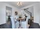 Cozy dining room featuring a wood table with covered chairs, hardwood floors, and stylish decor at 3338 Prospect Parkway Pkwy, Durham, NC 27703