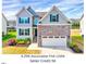 Beautiful two-story home featuring a stone facade and a two-car garage at 3338 Prospect Parkway Pkwy, Durham, NC 27703