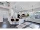 Bright kitchen with white cabinetry, an island with bar seating, and stainless steel appliances at 3338 Prospect Parkway Pkwy, Durham, NC 27703