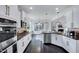 Modern kitchen featuring stainless steel appliances, granite countertops, and a stylish tile backsplash at 3338 Prospect Parkway Pkwy, Durham, NC 27703