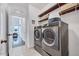 Convenient laundry room with modern washer and dryer, plus shelving at 3338 Prospect Parkway Pkwy, Durham, NC 27703