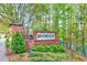 The brick Brightleaf at the Park neighborhood sign is surrounded by lush greenery at 3338 Prospect Parkway Pkwy, Durham, NC 27703