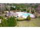 Aerial view of the community pool featuring mature trees and picnic areas at 3530 Winding Walk Ct, Raleigh, NC 27616