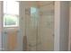 Modern bathroom with tiled shower and glass door at 3530 Winding Walk Ct, Raleigh, NC 27616