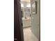 Bathroom with dual sink vanity and a marble-tiled shower stall at 3530 Winding Walk Ct, Raleigh, NC 27616