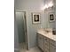 Bathroom featuring a double sink vanity, tile floor, and decorated with a sea shell theme at 3530 Winding Walk Ct, Raleigh, NC 27616