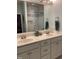 Bright bathroom featuring dual sink vanity with white cabinetry and modern fixtures at 3530 Winding Walk Ct, Raleigh, NC 27616