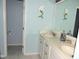 Bathroom with double vanity sinks and nautical decorations at 3530 Winding Walk Ct, Raleigh, NC 27616