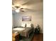 Cozy bedroom with ceiling fan, wood flooring, and soft, neutral decor at 3530 Winding Walk Ct, Raleigh, NC 27616