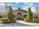 Charming clubhouse featuring stone accents, a symmetrical facade, and lush landscaping at 3530 Winding Walk Ct, Raleigh, NC 27616