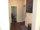 Hallway featuring wainscoting and a built-in chalkboard calendar at 3530 Winding Walk Ct, Raleigh, NC 27616