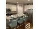 Eat-in kitchen featuring granite countertops, white cabinets, and modern appliances at 3530 Winding Walk Ct, Raleigh, NC 27616