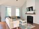 Cozy living room with a fireplace, and comfortable seating at 3530 Winding Walk Ct, Raleigh, NC 27616