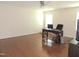 Spacious living room with hard wood floors, ceiling fan, and desk area with a computer at 3530 Winding Walk Ct, Raleigh, NC 27616