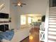 Bright living room featuring hardwood floors and a shiplap fireplace at 3530 Winding Walk Ct, Raleigh, NC 27616