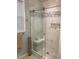Modern bathroom showcasing a glass-enclosed shower with decorative tile and a built-in niche at 3530 Winding Walk Ct, Raleigh, NC 27616