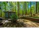 Lush backyard with a brick patio, perfect for outdoor relaxation and enjoying the surrounding nature at 3719 W Cornwallis Rd, Durham, NC 27705