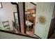 Bright dining area boasts wood table, black chairs, and a convenient kitchen pass-through for easy serving at 3719 W Cornwallis Rd, Durham, NC 27705