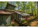 Charming home with a sunroom addition nestled amongst beautiful, mature trees offering serenity and seclusion at 3719 W Cornwallis Rd, Durham, NC 27705