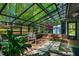Bright greenhouse featuring ample sunlight, perfect for gardening and plant cultivation year-round at 3719 W Cornwallis Rd, Durham, NC 27705
