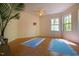 Sunny interior showcasing laminate floors and natural light streaming through the windows at 3719 W Cornwallis Rd, Durham, NC 27705