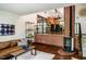 Inviting living room featuring hardwood floors, a modern fireplace, and a comfortable leather couch at 3719 W Cornwallis Rd, Durham, NC 27705