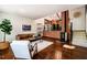 Bright living room with hardwood floors, fireplace and staircase at 3719 W Cornwallis Rd, Durham, NC 27705