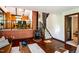 Cozy living room showcasing a brick accent wall with fireplace and hardwood floors throughout at 3719 W Cornwallis Rd, Durham, NC 27705
