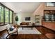 Bright living room with hardwood floors and a stunning view from a large window at 3719 W Cornwallis Rd, Durham, NC 27705