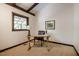 Tranquil office featuring a wooden desk and picture window views at 3719 W Cornwallis Rd, Durham, NC 27705