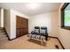 Cozy sitting room with a window overlooking nature at 3719 W Cornwallis Rd, Durham, NC 27705