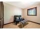 Comfortable sitting room with a window overlooking nature at 3719 W Cornwallis Rd, Durham, NC 27705