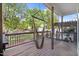 Inviting back porch with wooden deck and hanging hammock chairs, perfect for relaxation at 387 Windgate Dr, Clayton, NC 27527