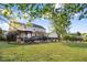 Large backyard features a pool, lounge chairs, grilling area, and lush green grass at 387 Windgate Dr, Clayton, NC 27527