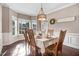 Formal dining room with large windows, chandelier lighting, and ample space for Gathering gatherings at 387 Windgate Dr, Clayton, NC 27527