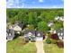 Aerial view of a charming home featuring a well-manicured lawn, welcoming porch, and inviting curb appeal at 387 Windgate Dr, Clayton, NC 27527