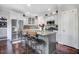 Stylish kitchen with stainless steel appliances, gray cabinets, and a charming breakfast bar at 387 Windgate Dr, Clayton, NC 27527