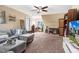 Cozy living room with comfortable sectional, TV, and lots of natural light from the window at 387 Windgate Dr, Clayton, NC 27527