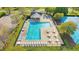 Community pool and amenity with lounge chairs, tables, and well-maintained grounds, perfect for summer gatherings at 387 Windgate Dr, Clayton, NC 27527