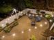Overhead shot of a backyard patio with string lights and cozy furniture perfect for entertaining at 3920 Bentley Brook Dr, Raleigh, NC 27612