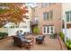 Inviting backyard brick patio with comfortable seating with brick building in background at 3920 Bentley Brook Dr, Raleigh, NC 27612