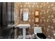 Charming half bath with unique wallpaper and classic fixtures at 3920 Bentley Brook Dr, Raleigh, NC 27612