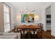 Bright dining room with hardwood floors, modern lighting, and elegant wall art at 3920 Bentley Brook Dr, Raleigh, NC 27612